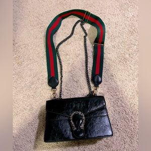 The Gucci Horse Shoe Dionysus small shoulder bag
